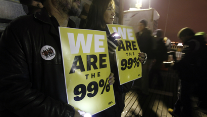 People holding "We are the 99%" posters.
