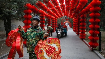 Workers decorate Ditan Park to celebrate the upcoming China Lunar New Year in Beijing, China, 16 January 2017. The Chinese Lunar New Year, or Spring Festival, which falls on 28 January this year will mark the Year of the Rooster.