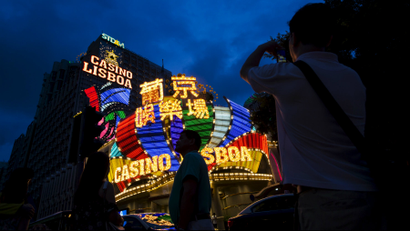 Mainland Chinese visitors are pictured in front of Casino Lisboa in Macau.