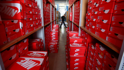 Staff member Greg prepares a delivery in the Nike section in the warehouse of local footwear retailer "Pomp It Up" in Bussigny near Lausanne, Switzerland