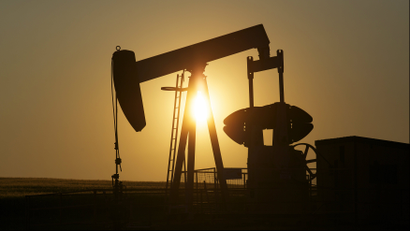 An oil pump jack pumps oil in a field near Calgary, Alberta, July 21, 2014.