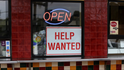 A help wanted sign at a store in California