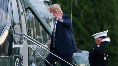 U.S. President Donald Trump boards Marine One as he departs Walter Reed National Military Medical Center.