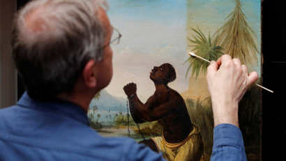 David Crombie, Senior Paintings Conservator at the National Museums, Liverpool carries out restoration work on the painting 'Am Not I A Man And A Brother', one of only 2 known paintings of its type in existence in Liverpool, Britain, July 30, 2019.