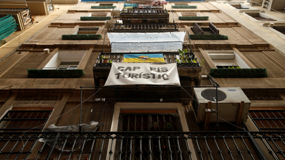 A banner in Barcelona, Spain, reads "No tourist apartments."