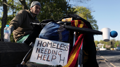 A homeless man asks for help