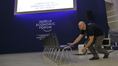 A technician lines up the chairs at the congress center where the World Economic Forum will take place later this week in Davos, Switzerland, Monday Jan. 18, 2016. The world's political and business elite are being urged to do more than pay lip service to growing inequalities around the world as they head off for this week's World Economic Forum in the Swiss ski resort of Davos this week. (AP Photo/Michel Euler)