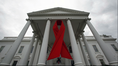 A red ribbon hangs from the pillars of a courthouse in Washington to commemorate World AIDS Day.