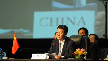 Chinese President Xi Jinping listens during the BRICS 2013 Summit in Durban, South Africa, Wednesday March 27, 2013. Heads of State of BRICS nations met in the South African city of Durban for the two-day summit.
