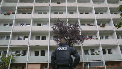 German policemen search a housing area in Chemnitz on suspicion that a bomb attack was being planned.
