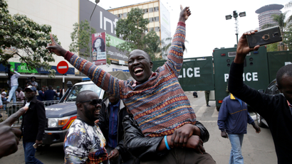 Supporters of an opposition leader Raila Odinga cheer outside the court after President Uhuru Kenyatta's election win was declared invalid in Nairobi, Kenya, September 1,