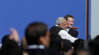 Facebook CEO Mark Zuckerberg, right, hugs Prime Minister of India Narendra Modi at Facebook in Menlo Park, Calif., Sunday, Sept. 27, 2015. A rare visit by Indian Prime Minister Narendra Modi this weekend has captivated his extensive fan club in the area and commanded the attention of major U.S. technology companies eager to extend their reach into a promising overseas market. (AP Photo/Jeff Chiu)