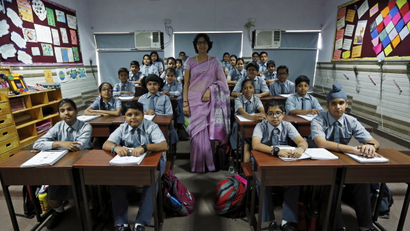 Teacher Archana Shori poses for a picture with 7th-grade level students inside their classroom at Rukmini Devi Public school in New Delhi, India, September 7, 2015. Nearly three years after Taliban gunmen shot Pakistani schoolgirl Malala Yousafzai, the teenage activist last week urged world leaders gathered in New York to help millions more children go to school. World Teachers' Day falls on 5 October, a Unesco initiative highlighting the work of educators struggling to teach children amid intimidation in Pakistan, conflict in Syria or poverty in Vietnam. Even so, there have been some improvements: the number of children not attending primary school has plummeted to an estimated 57 million worldwide in 2015, the U.N. says, down from 100 million 15 years ago. Reuters photographers have documented learning around the world, from well-resourced schools to pupils crammed into corridors in the Philippines, on boats in Brazil or in crowded classrooms in Burundi.