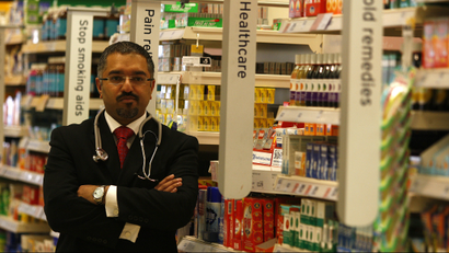 Doctor standing in pharmacy