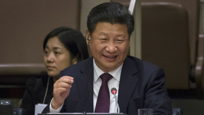 China's President Xi Jinping laughs during the Global Leaders' Meeting on Gender Equality and Women's Empowerment at the United Nations headquarters in Manhattan, New York, September 27, 2015.