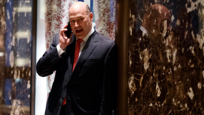 Goldman Sachs COO Gary Cohn talks on the phone as he waits for the start of a meeting with President-elect Donald Trump at Trump Tower, Tuesday, Nov. 29, 2016, in New York.