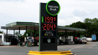 Increased fuel prices are pictured on a display board at a filling station in Staffordshire, England.