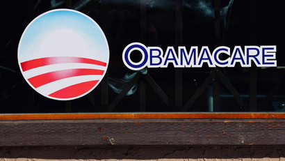 Obamacare sign in store window.