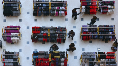 Customers shop inside a department store in Shenyang, Liaoning province in China.