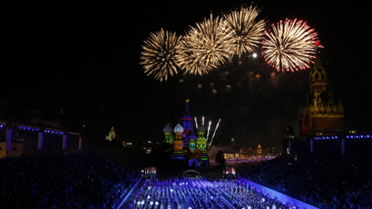 Fireworks explode above Saint-Basil's cathedral during the final day of the International Military Music Festival "Spasskaya Tower" in Red Square in Moscow September 7, 2014.