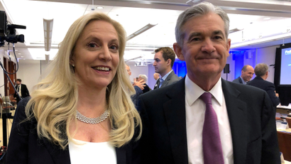 Federal Reserve Chairman Jerome Powell poses for photos with Fed Governor Lael Brainard at the Federal Reserve Bank of Chicago