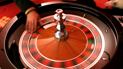 Croupier turns the roulette at the Brussels Casino