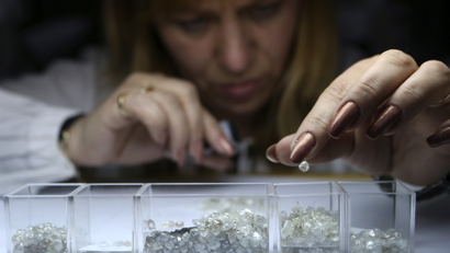 An Alrosa employee sorts rough diamonds at a facility in Moscow.