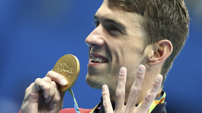2016 Rio Olympics - Swimming - Victory Ceremony - Men's 200m Individual Medley Victory Ceremony - Olympic Aquatics Stadium - Rio de Janeiro, Brazil - 11/08/2016. Michael Phelps (USA) of USA poses with his gold medal. REUTERS/Michael Dalder FOR EDITORIAL USE ONLY. NOT FOR SALE FOR MARKETING OR ADVERTISING CAMPAIGNS.