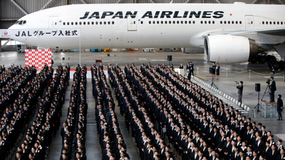 Newly-hired employees of Japan Airlines (JAL) group attend the company group's initiation ceremony at a hangar of Haneda airport in Tokyo, Japan, April 2, 2018.