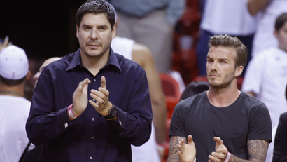 Former soccer player David Beckham (R) and Marcelo Claure, CEO of Brightstar applaud before Game 5 of the NBA Eastern Conference final