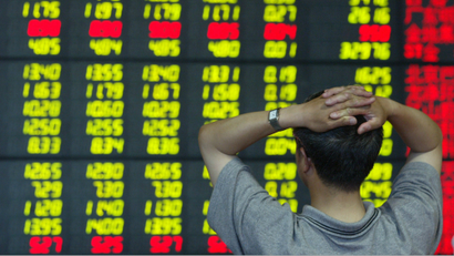 An investor monitors stock prices at a securities firm