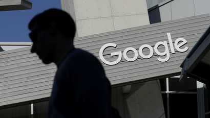 A man walks past a building on the Google campus in Mountain View, California.