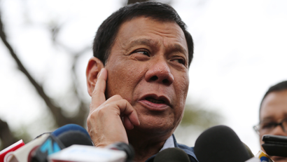 Philippine presidential candidate Rodrigo Duterte gestures as he answers questions from reporters at the University of the Philippines in suburban Quezon city, north of Manila, Philippines, Thursday, Feb. 18, 2016. Five candidates are running for President in the coming elections this May