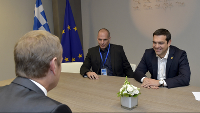 Greek Prime Minister Alexis Tsipras (R) and Finance Minister Yanis Varoufakis (C) are welcomed by European Council President Donald Tusk ahead of a meeting during a Eurozone emergency summit on Greece in Brussels, Belgium June 22, 2015.