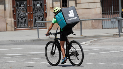A Deliveroo rider on his bike