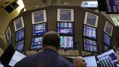 Traders work at the Goldman Sachs posts on the floor of the New York Stock Exchange Thursday, March 15, 2012.