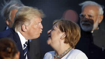 Trump kissing Angela Merkel