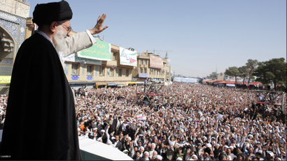 Iran's Supreme Leader Ayatollah Ali Khamenei waves to the crowd in the holy city of Qom, 120 km (75 miles) south of Tehran, October 19, 2010.