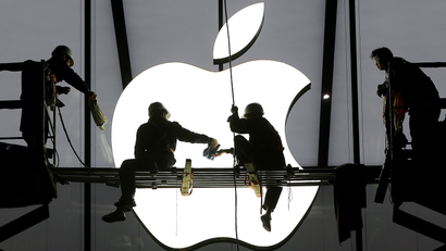 workers with Apple logo