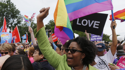 Gay rights supporters celebrate outside the U.S. Supreme Court building