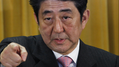 Japan's Liberal Democratic Party President Shinzo Abe points a reporter during a question and answer during a press conference at the party headquarters in Tokyo Monday, Dec. 17, 2012, a day after the party's landslide victory over the ruling Democratic Party of Japan led by Prime Minister Yoshihiko Noda in parliamentary elections. Abe stressed Monday that the road ahead will not be easy as he tries to revive Japan's sputtering economy and bolster its national security amid deteriorating relations with China.
