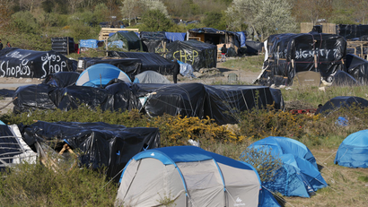 General view of a field with tents and makeshift shelters where migrants and asylum seekers stay in Calais, France, April 30, 2015.