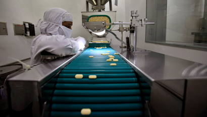 In this file photo taken Thursday, Feb. 9, 2012, a pharmacist is seen working in a lab where medicines are being produced at a manufacturing unit on the outskirts of Mumbai, India.