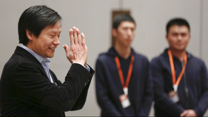 Lei Jun, founder and CEO of China's mobile company Xiaomi gestures as he attends a press conference during the period of Chinese People's Political Consultative Conference (CPPCC) and National People's Congress (NPC) in Beijing, China