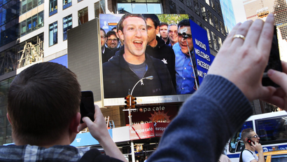 Facebook Inc. CEO Mark Zuckerberg is seen on a screen televised from their headquarters in Menlo Park moments after their IPO launch in New York