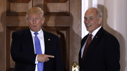 President-elect Donald Trump talks to media as he stands with retired Marine Gen. John Kelly