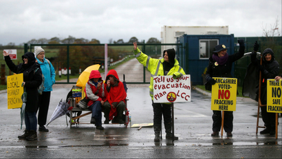Protesters stand outside Cuadrilla's Preston New Road fracking site near Blackpool, Britain