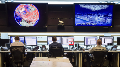 People sit at computers in the 24 hour Operations Room inside GCHQ, Cheltenham in Cheltenham