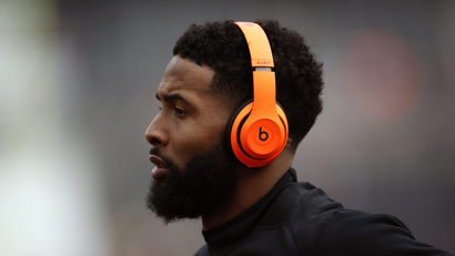A football player wearing headphones