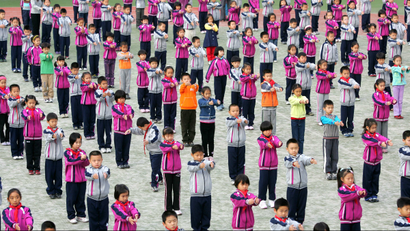 Beijing primary school chidren do organized exercises.
